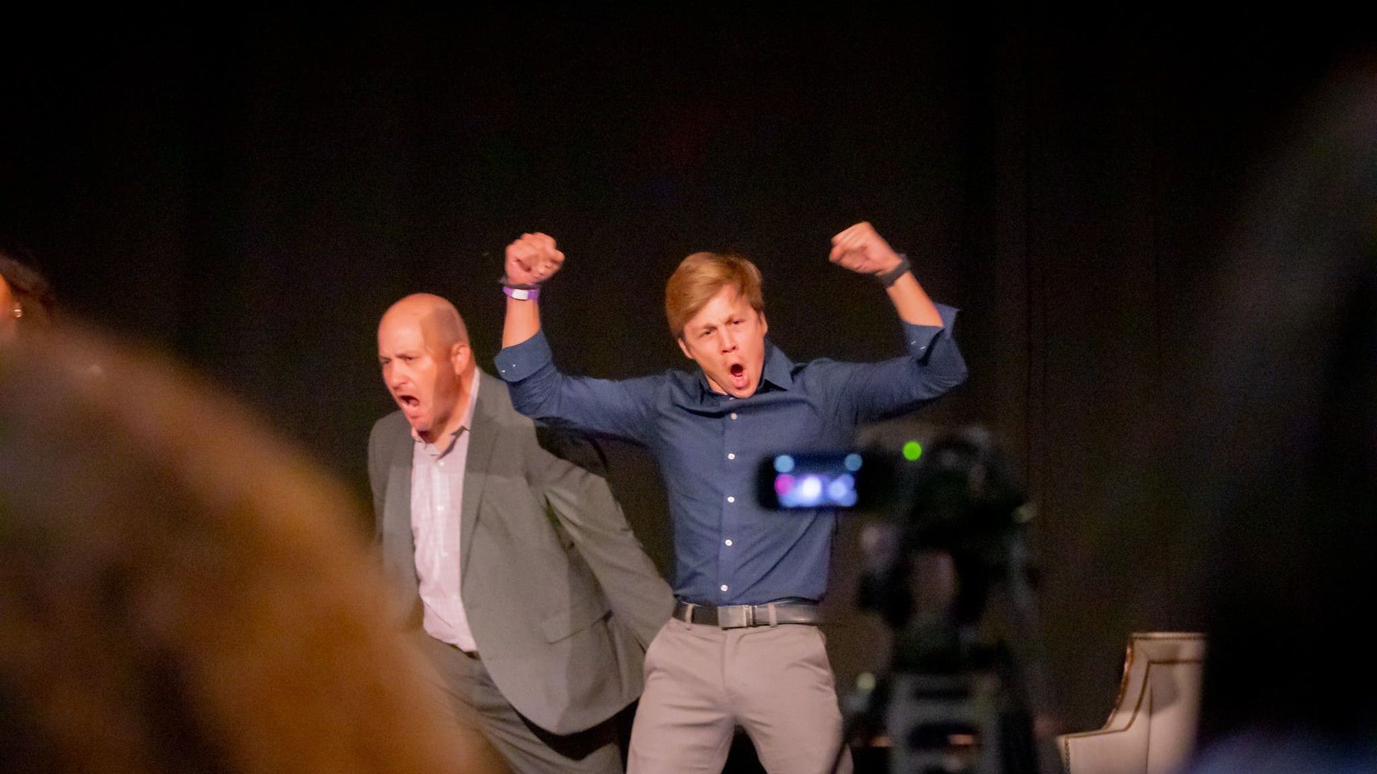 A father and son entrepreneur celebrating.